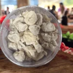 A top-down close-up view of Dailer Bori, showing the unique, rustic texture of the individual dried lentil dumplings.