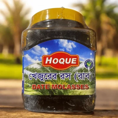 A jar of Hoque brand Date Molasses, also known as Khejur Gur, a natural liquid sweetener from Bangladesh.