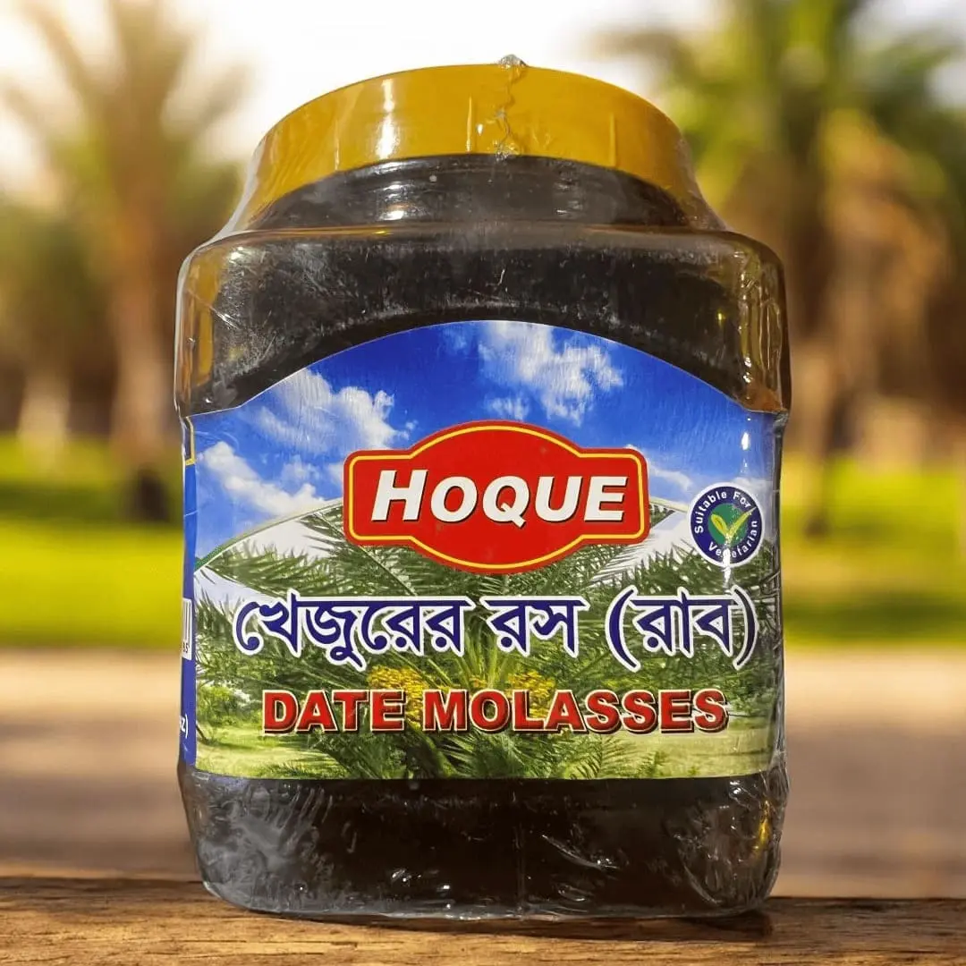 hoque-date-molasses-khejur-gur A jar of Hoque brand Date Molasses, also known as Khejur Gur, a natural liquid sweetener from Bangladesh.