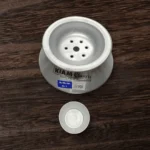 The Kiam Classic Pitha Hari pot shown with its small 'sora' or mould, used for shaping individual steamed rice cakes.