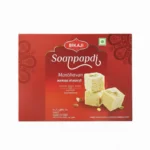 Bikaji Manbhavan Soanpapdi (Flaky Sweet) with almonds and pistachios, front view of red box.