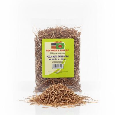 A 3.5 oz pack of New Hoque & Sons Inc. Pooja Nuts Thin Lachhi with some contents scattered in front.
